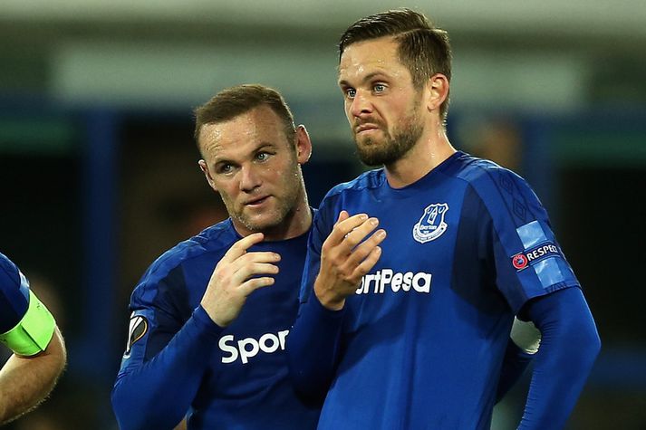 Gylfi Þór Sigurðsson og Wayne Rooney.