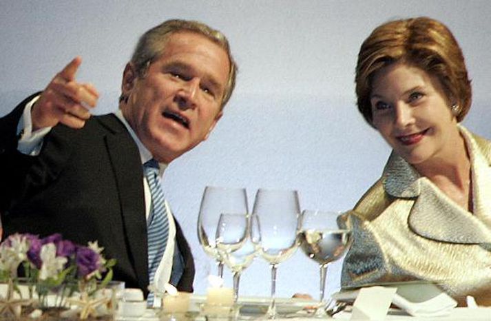 Hjónin George Bush og Laura Bush eru ekki sammála um allt. Mynd/ AFP.