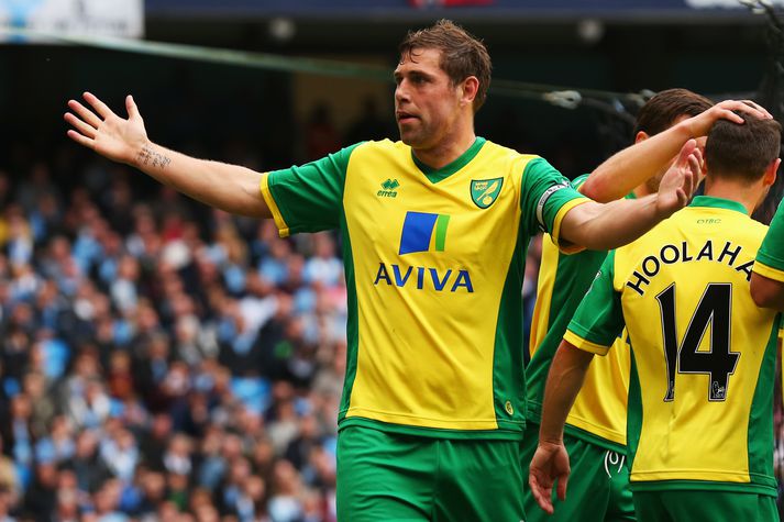 Grant Holt fagnar marki gegn Manchester City árið 2013.