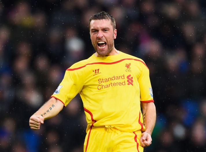 Lambert fagnar í leik með Liverpool.