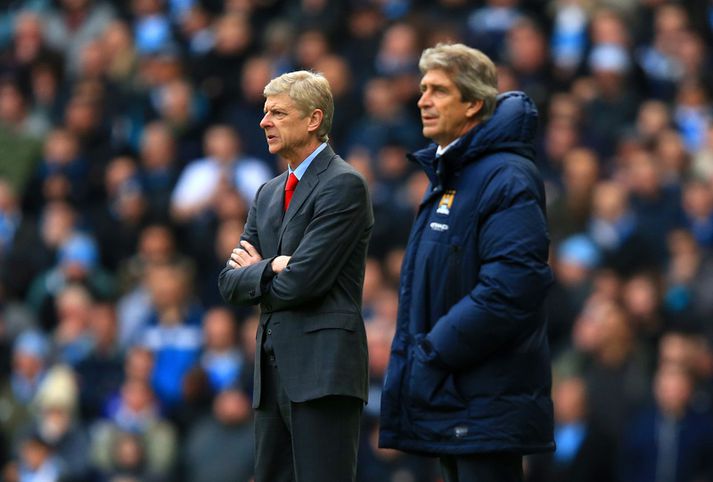 Wenger og Manuel Pellegrini, stjóri City, á hliðarlínunni í dag.