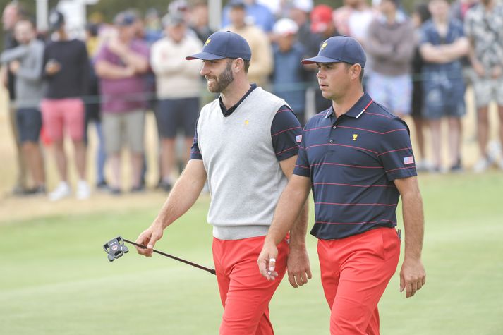 Dustin Johnson og Gary Woodland unnu sína viðureign.