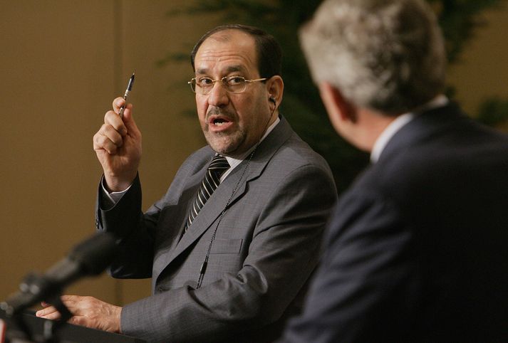 Nouri al-Maliki og George W. Bush Bandaríkjaforseti hlýðir á forsætisráðherra Íraks á blaðamannafundi að loknum fundi þeirra í Jórdaníu í gær.