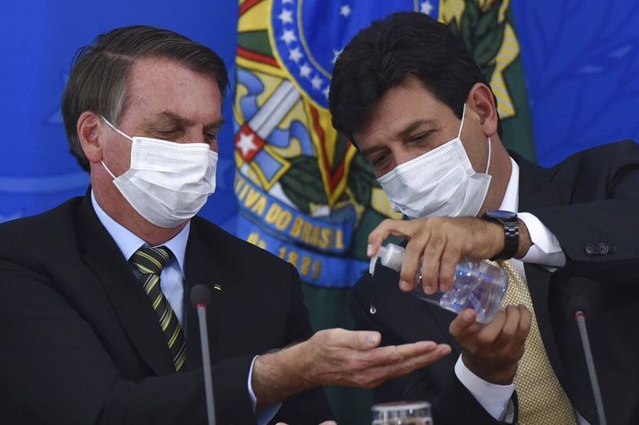 Jair Bolsonaro Brasilíuforseti og Luiz Henrique Mandetta heilbrigðisráðherrann fyrrverandi.