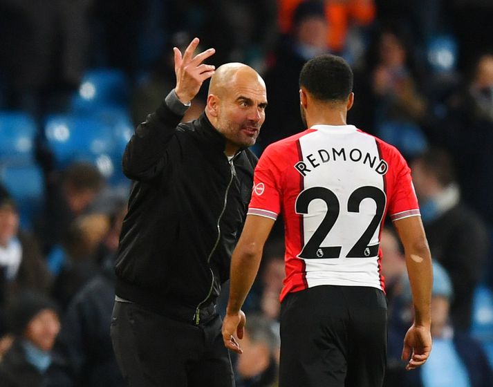 Á látbragði Guardiola virðist erfitt að túlka annað en að hann hafi verið að skammast í Redmond