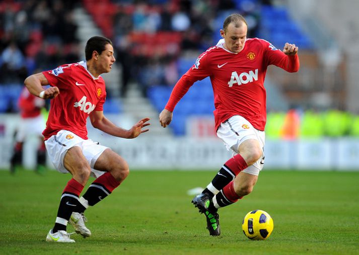 Rooney skoraði og lagði upp mark gegn Wigan í gær.
