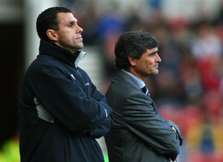 Poyet og Juande Ramos horfðu upp á sína menn fá kjaftshögg í dag