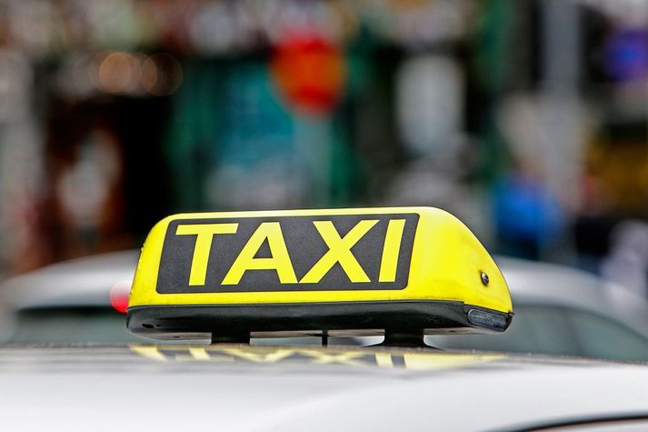 Taxi Taxi light on the top of a cab.