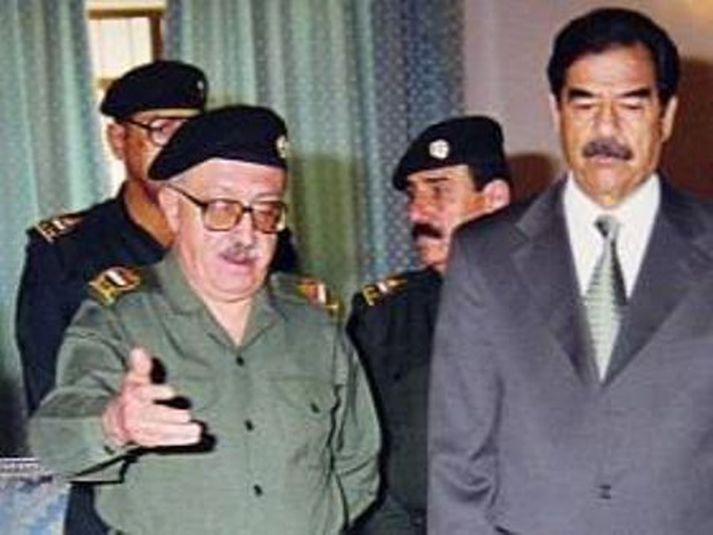 Tarik Aziz ásamt foringja sínum Saddam Hussein.