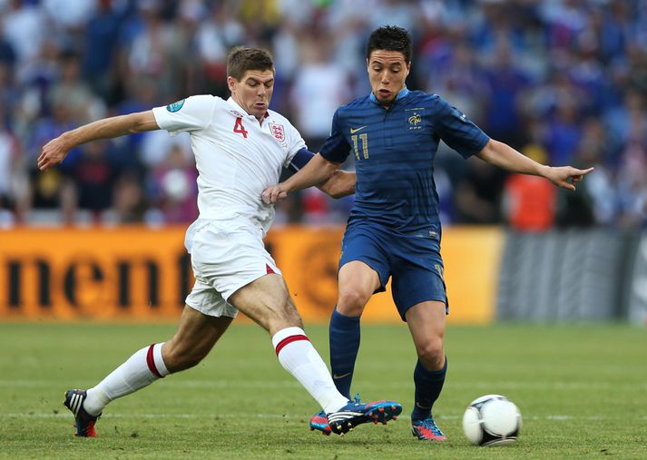 Gerrard og Nasri í baráttunni í dag.