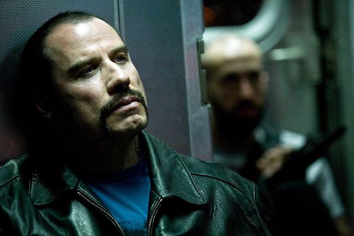 John Travolta í hlutverki Ryders í myndinni Taking of Pelham 1 2 3. Sá segist hafa farið í hundasleðaferð á Íslandi með undirfatafyrirsætu.