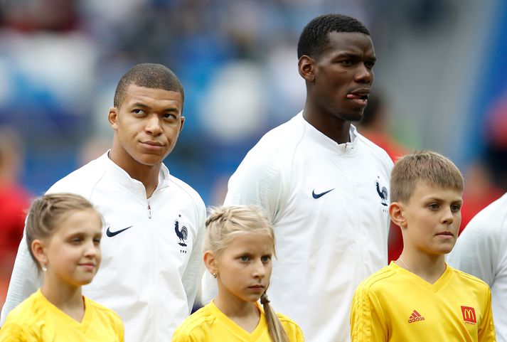 Kylian Mbappé og Paul Pogba eru báðir frá París og eru synir innflytjenda.