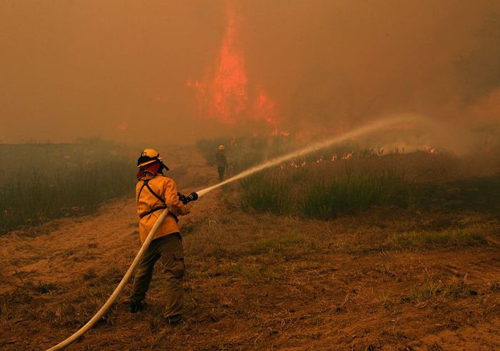 Erfiðlega hefur gengið að slökkva eldana í Texas.nordicphotos/AFP