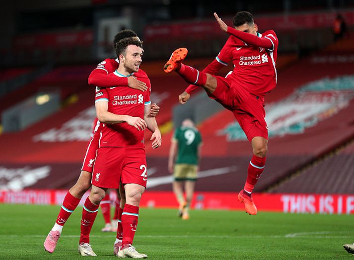 Jota, Firmino og Trent fagna sigurmarkinu.