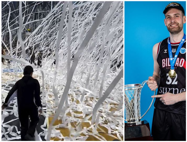 Tryggvi Snær Hlinason með bikarinn sem Bilbao Basket vann en til hliðar má sjá klósettpappírinn út um allt á vellinum.