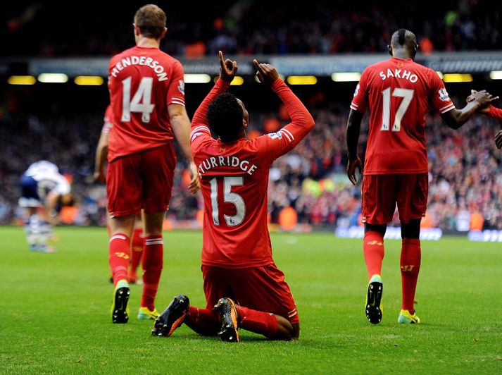 Sturridge fagnar glæsimarki sínu í dag.