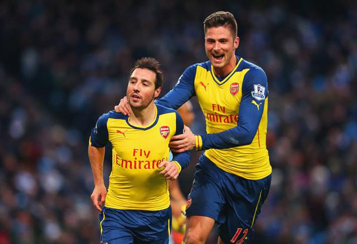 Santi Cazorla og Oliver Giroud fagna marki þess fyrrnefnda.
