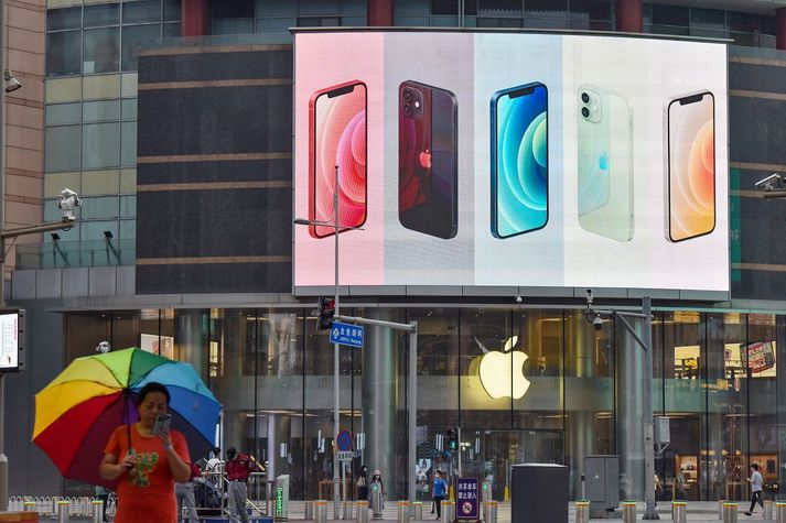 iPhone smartphones seen displayed on a large screen outside