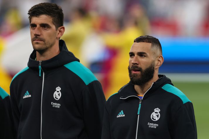 Liverpool FC v Real Madrid - UEFA Champions League Final 2021/22 PARIS, FRANCE - MAY 28: Thibaut Courtois and Karim Benzema of Real Madrid look on during the line up prior to the UEFA Champions League final match between Liverpool FC and Real Madrid at Stade de France on May 28, 2022 in Paris, France. (Photo by Jonathan Moscrop/Getty Images)