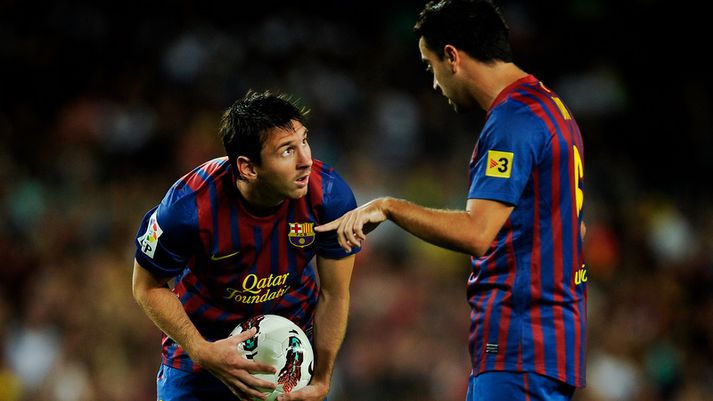 Lionel Messi og Xavi Hernandez.