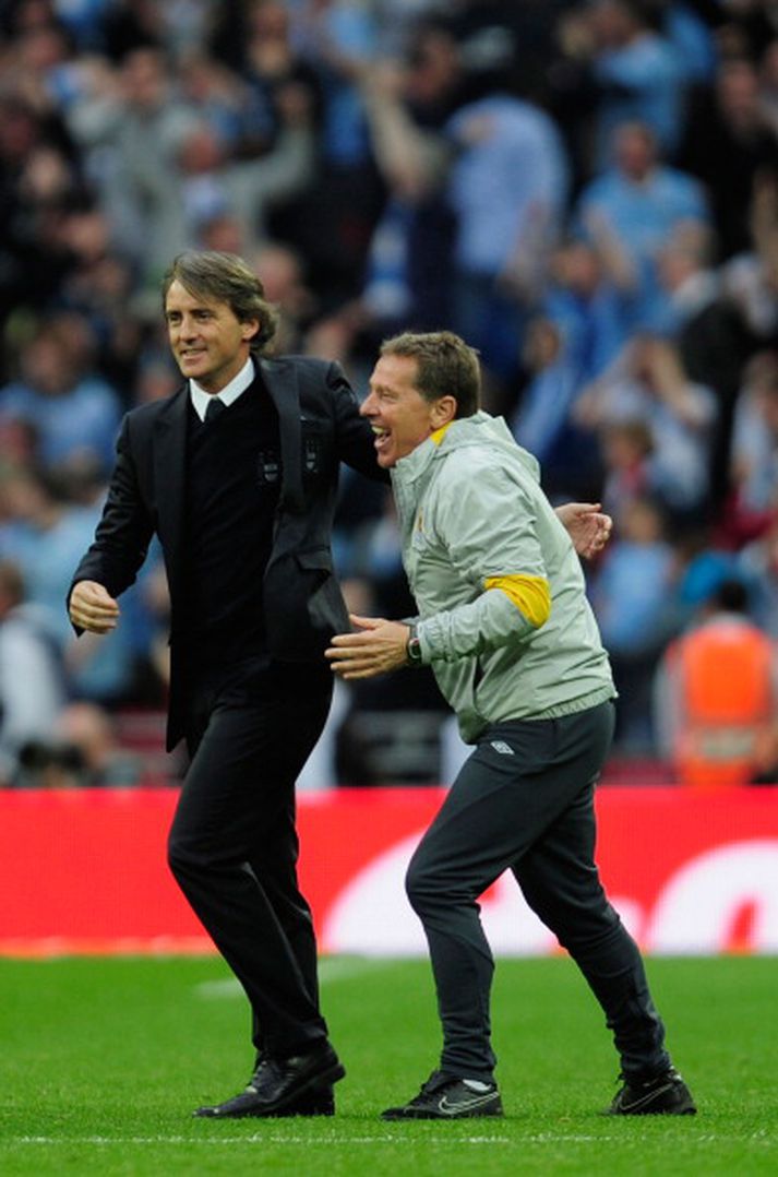 Roberto Mancini knattspyrnustjóri Manchester City telur að liðið þurfi að styrkja sig enn frekar á leikmannamarkaðinum.