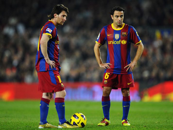 Xavi Hernandez og Lionel Messi.