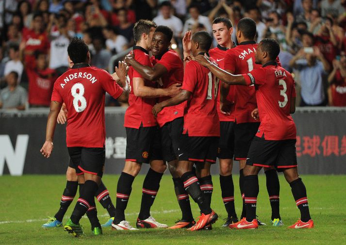 United fagnar marki í Hong Kong í dag.