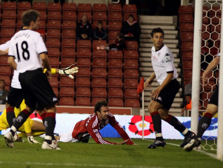 Danny Higginbotham sést hér koma Stoke í 1-0.