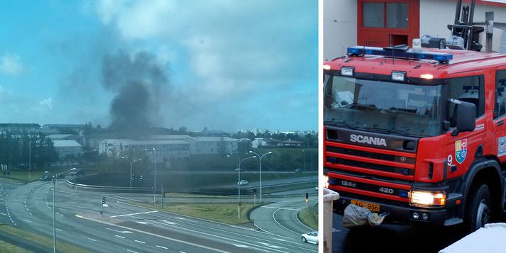 Talsverðan reyk lagði yfir Árbæ í morgun eftir að eldur kom upp í bíl.