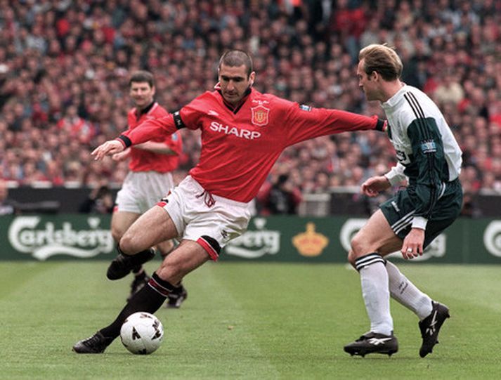 Cantona í leik gegn Liverpool.