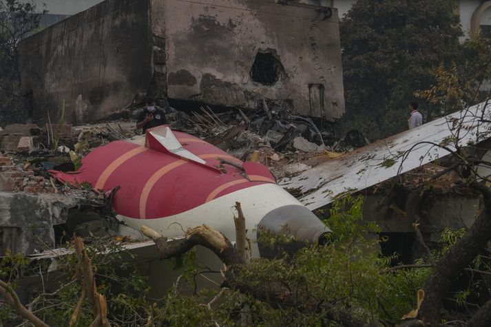 APTOPIX India Plane Crash Parts of an Air India plane that crashed on Thursday are seen on top of a building in Ahmedabad, India, Friday, June 13, 2025. (AP Photo/Rafiq Maqbool)