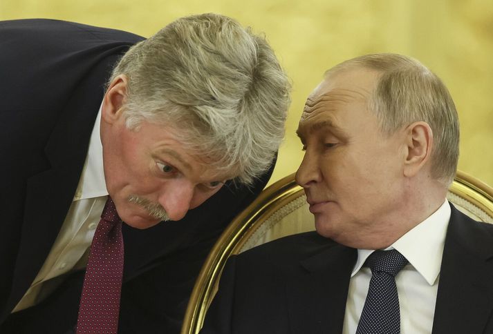 Dmitrí Pekóv og Vladimír Pútín.