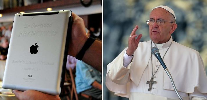 Á bakhlið tölvunnar er að finna merki Frans páfa og Vatikansins.