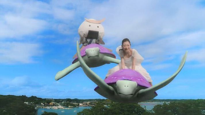 Hér má sjá Mitsu Dan og hrísgrjónakallinn svífa um á baki skjaldbaka.