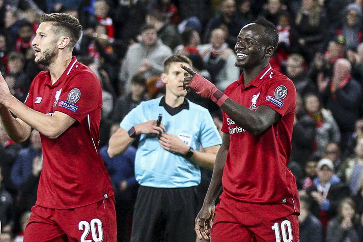 Sadio Mane og Adam Lallana. Mane er einn besti leikmaður Liverpool en Lallana er í aukahlutverki. Lallana fær samt 1,6 milljónum meira útborgað í viku hverri.