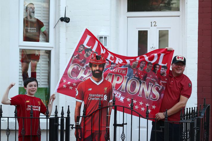 Stuðningsmenn Liverpool fagna Englandsmeistaratitlinum um allan heim í kvöld.