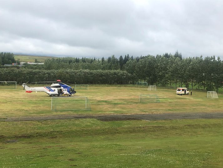 Þyrla Landhelgisgæslunnar var kölluð út vegna slyssins og sést hún hér í Reykholti fyrr í dag.