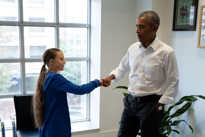 Obama sagði Thunberg að þau væru saman í liði þegar þau gáfu hvor öðru kumpánlega kveðju.