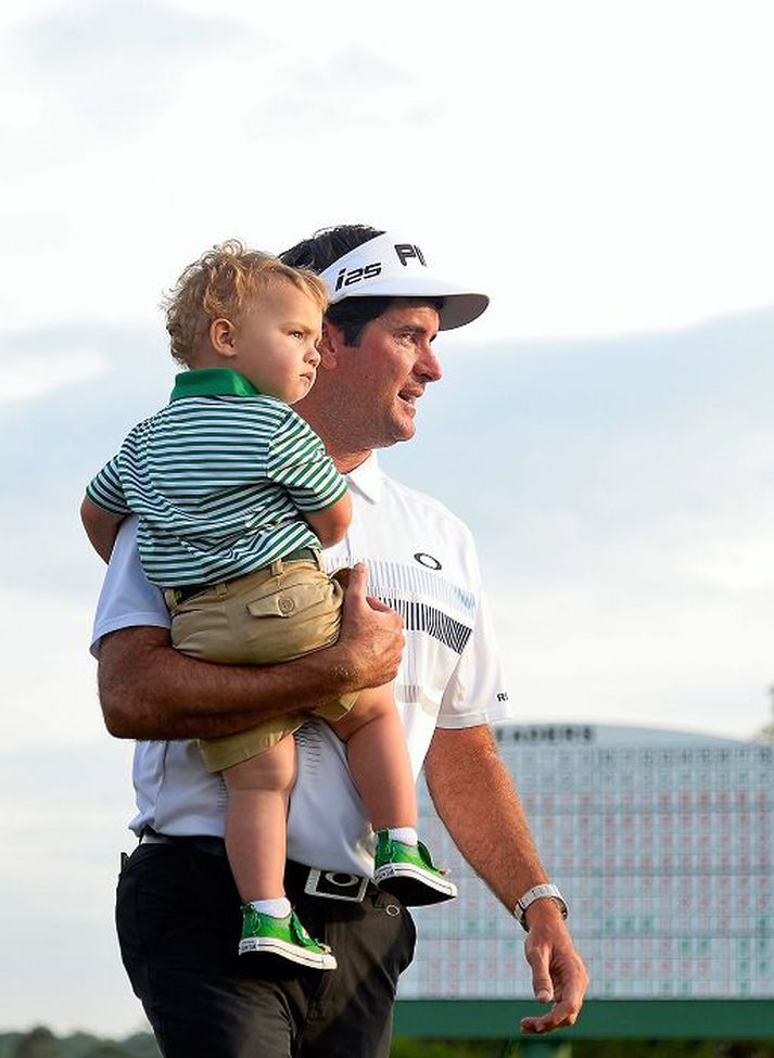 Bubba Watson með ættleidda soninn Caleb Watson eftir sigur á Masters 2014 á Augusta-vellinum.