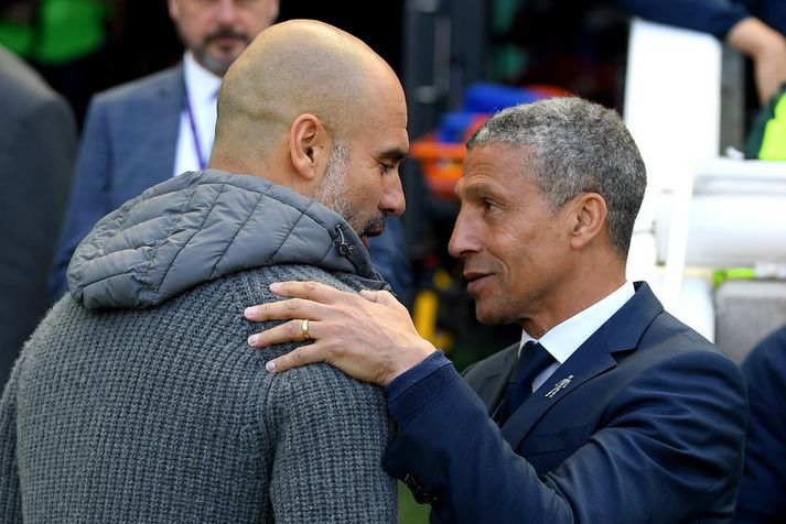 Chris Hughton með Pep Guardiola í gær.