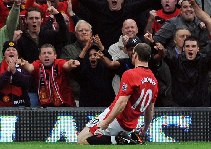 Rooney fagnar marki sínu í dag.