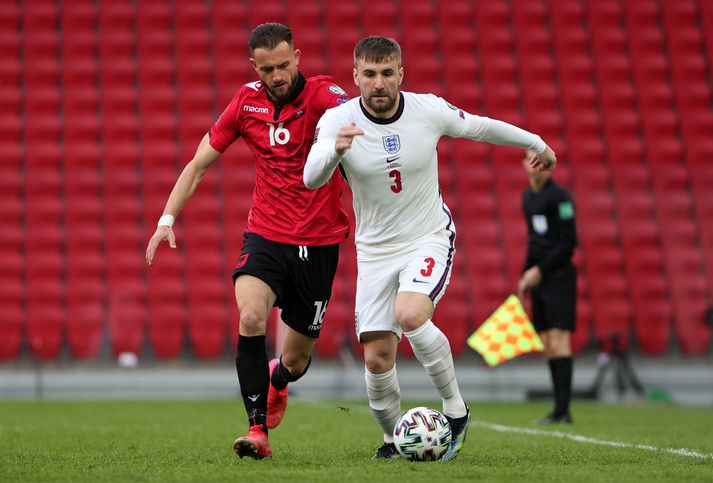 Albania v England - FIFA World Cup 2022 Qatar Qualifier TIRANA, ALBANIA - MARCH 28: Luke Shaw of England is closed down by Sokol Cikalleshi of Albania during the FIFA World Cup 2022 Qatar qualifying match between Albania and England at the Qemal Stafa Stadium on March 28, 2021 in Tirana, Albania. Sporting stadiums around Europe remain under strict restrictions due to the Coronavirus Pandemic as Government social distancing laws prohibit fans inside venues resulting in games being played behind closed doors. (Photo by Srdjan Stevanovic - The FA/The FA via Getty Images)