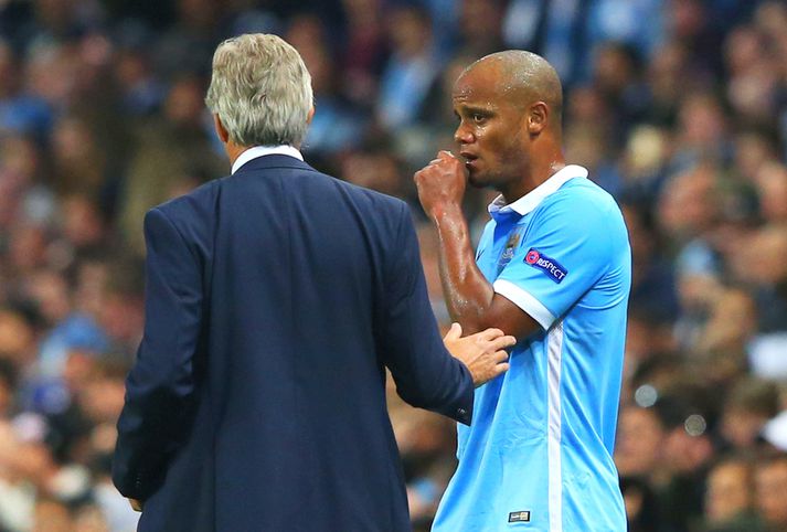 Kompany ræðir við Pellegrini.