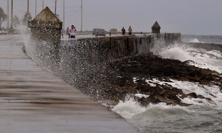 Fay gengur yfir Flórída í dag. Mynd/ AFP.