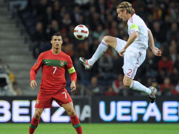 Christian Poulsen og Cristiano Ronaldo í leiknum í gær.
