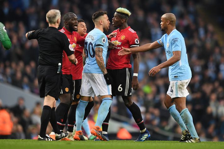 Paul Pogba og Nicolás Otamendi voru ekki alveg sáttir í leiknum um helgina.