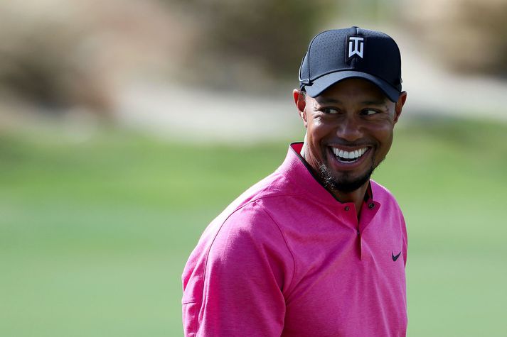 Tiger Woods er farinn að brosa á ný.