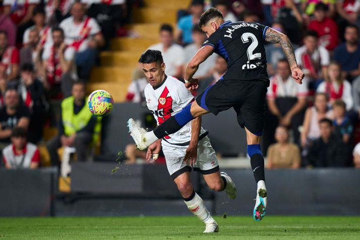 Radamel Falcao og Jose Gimenez í baráttunni í kvöld.