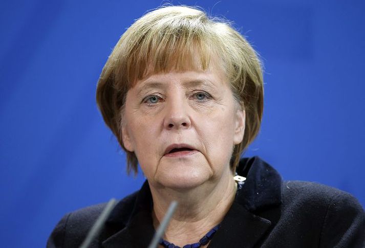 Angela Merkel er að vonum sátt við skuldalækkunina.