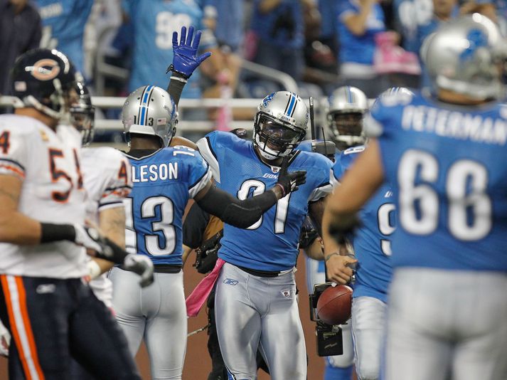 Calvin Johnson fagnar í nótt.